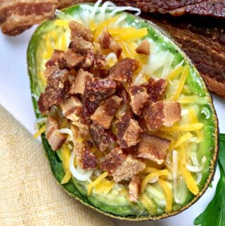 Are you looking for a delicious keto breakfast idea? These low carb loaded avocado baked eggs feature my favorite ketogenic ingredients - bacon, cheese, eggs and avocado!