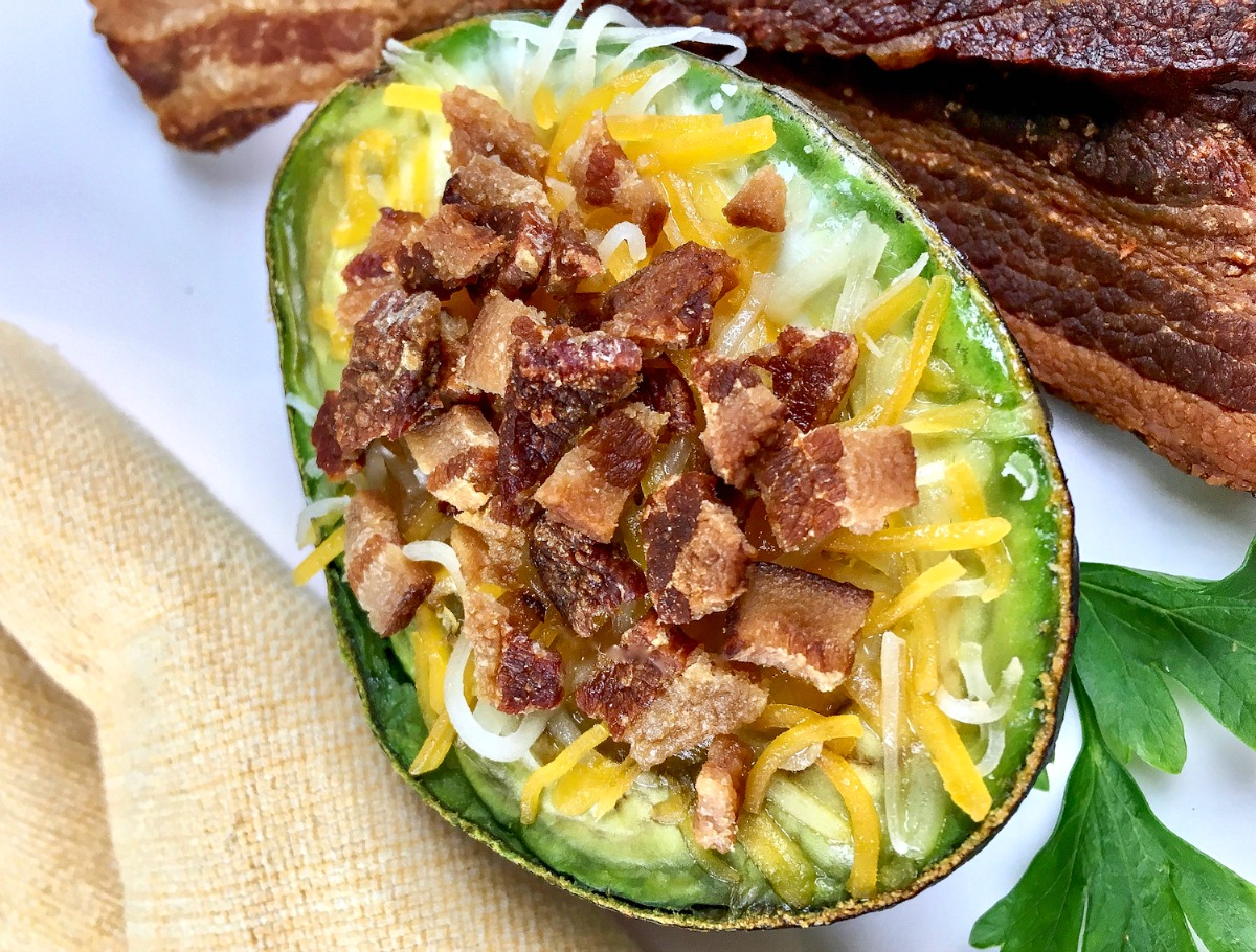 Are you looking for a delicious keto breakfast idea? These low carb loaded avocado baked eggs feature my favorite ketogenic ingredients - bacon, cheese, eggs and avocado!