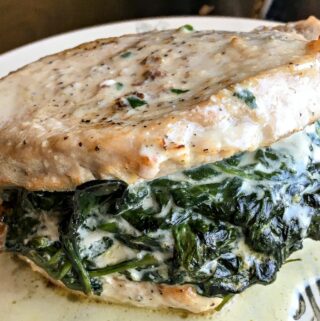 Are you looking for a hearty and delicious low carb dinner idea? This Creamed Spinach Stuffed Pork Chops recipe is the perfect keto meal.