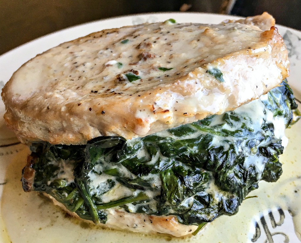 Are you looking for a hearty and delicious low carb dinner idea? This Creamed Spinach Stuffed Pork Chops recipe is the perfect keto meal.