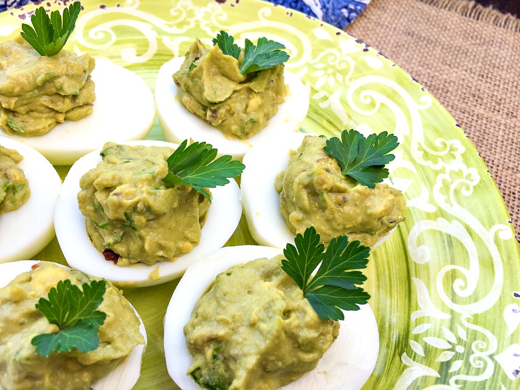 Our easy spicy avocado keto deviled eggs recipe is the best low carb appetizer if you're following the ketogenic diet.