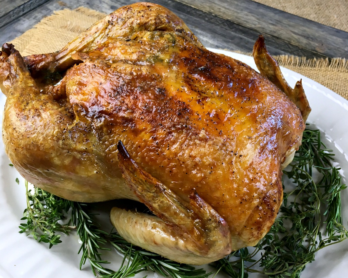 Wondering what to do with a whole chicken? This Garlic Herb Oven Roasted Whole Chicken will make your mouth water. It's one of my favorite recipes to make in the oven!