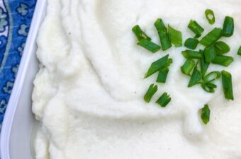 Cauliflower is super popular with people on the keto diet, and for good reason. It's a very versatile vegetable! One of my favorite low carb side dish recipes is this yummy Garlic & Chive Mashed Cauliflower!