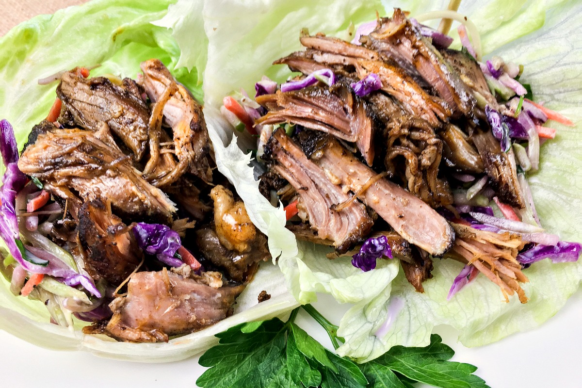 Are you looking for a delicious low carb meal idea to make in your crockpot? This low carb slow cooker pulled pork lettuce wraps recipe is keto diet friendly, delicious and almost effortless for ketogenic dinners!